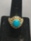 Oval 11x9mm Turquoise Cabochon Center w/ Twin Blue Topaz Sides Gold-Tone Sterling Silver Ring Band