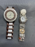 Lot of Two Geneva Branded Stainless Steel Watches, One Round 22mm Face & One Oval 15x12mm Face w/