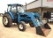 New Holland 7740 2WD Tractor w/ Cab & A/C and New Holland 7210 Front End Loader