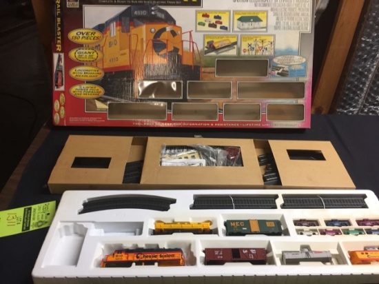 HO Scale train set with track and car bodies.