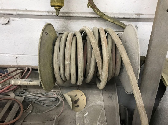 Wall mounted hose reel, with approx 25-50 foot of hose