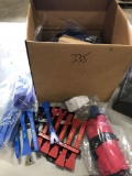 Box of several plastic pry-bars and pry tools, most are new