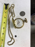 Swiss made watch, Susan B Anthony Dollar, and a gold toned chain