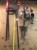 Lot includes, pry bars, clamp, and pullers