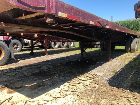 1981 Fruehauf 35 foot flatbed tubing trailer w/ rolling tail board