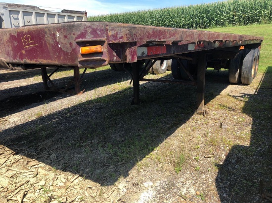 1977 Strickland 30 ft flatbed tubing trailer w/ rolling tail board