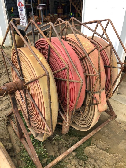 4 slot discharge hose reel with hoses.