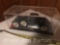 Older model car, in display case