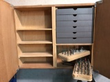 Custom made cabinet with numerous router bits