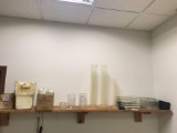 Shelf of misc testing and lab supplies