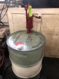 Approx half full drum of Mineral Spirits LT-I And hand crank pump