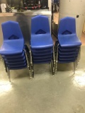 17 smaller blue plastic school chairs