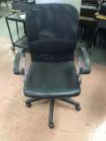 Black office chair on casters