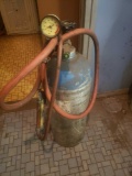 Empty tank with hose and gauge