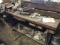 Wooden workbench With misc contents, with vise, work light and more.