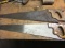 2 hand saws one is marked Disston Model 23 inch 8 point