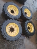 Four 8 lug skid loader tires