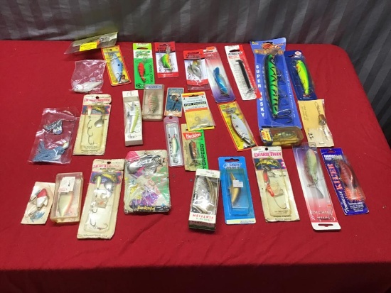 Large collection of fishing lures, many in original packages, some vintage