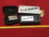 Tunemaster guitar tuner and antique lighter