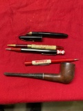 Collection of Fountain Pens, Oil Advertising, and pipe