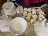 Large quantity of milkglass, plates, saucers, mugs and more