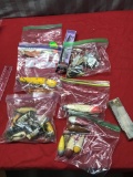 Various assorted fishing lures, some are wooden