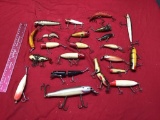 Large collection of fishing lures, several are wooden