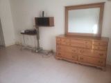 2 rolling adjustable end tables, a very nice dresser with mirror, breathing machine and more see