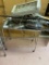 Stainless steel table on casters, and assorted scrap metal.