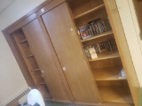 Cabinetry shelving with many classic comedy vhs movies