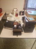 2 square tables with contents gumball machine, older video camera sound systems, dvd players glass