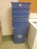 Stack of 8 blue trash cans