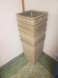 Stack of tan trash cans