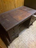 Wooden desk with hidden typewriter compartment