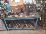 HD 5 ft work shop table with a variety of tooling drill bits, end mills, large screws, washers, nuts