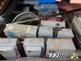 Steel shipping crate full of assorted power boxes and supply