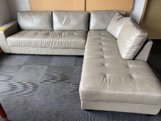 Leather Sectional in front in lounging area.