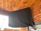 Large Flat Panel TV on back porch w/ panel and cover. All TV?s were covered throughout the winter