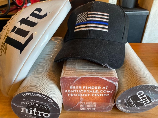 Group of new coasters, Miller Lite football, First responders hat