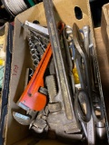 Assorted pipe wrenches and hand tools