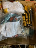 Flat load of assorted gloves and hones and lanyard