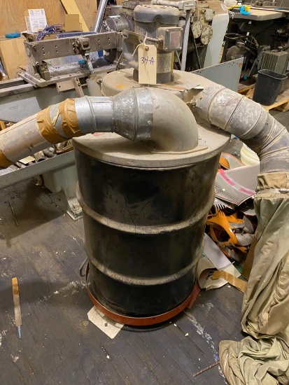 Custom made portable dust collector, made from a 55 gallon drum, on cart