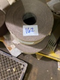 Several rolls of abrasive paper