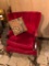 Wingback red velvet chair on claw and ball foot