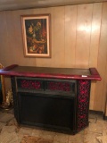Retro bar with red velvet accents and vintage stereo components