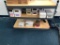 Shelving Unit with boxes of various color and size small grommets