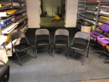 Set of 4 black folding chairs