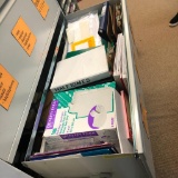 Drawer full of office supplies