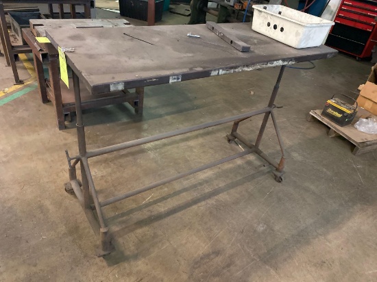Rolling metal work table on casters, 56 inches long