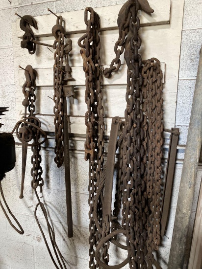 Wall of assorted chains, hooks and cables. See pics